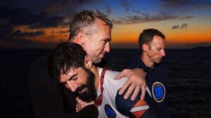 Friends hugging, lifestyle image